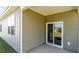 Covered patio with sliding glass door leading to backyard at 580 Duvall St., Longs, SC 29568