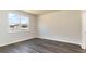 Bedroom with large window and gray vinyl flooring at 580 Duvall St., Longs, SC 29568