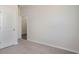 Bedroom with neutral walls, carpet, and a door at 580 Duvall St., Longs, SC 29568