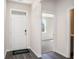 Bright entryway with door, hardwood floor, and view into room at 580 Duvall St., Longs, SC 29568