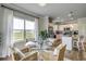 Modern kitchen with white cabinets, granite countertops, and an island with seating at 652 Parker Ct., Myrtle Beach, SC 29588