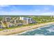 Aerial view showcasing a beachside high-rise condo building and resort at 210 75Th Ave. N # 4045, Myrtle Beach, SC 29572