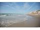 Expansive beach with waves gently rolling ashore at 210 75Th Ave. N # 4045, Myrtle Beach, SC 29572