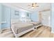 Bedroom with two beds, light blue walls, and wood-look floors at 210 75Th Ave. N # 4045, Myrtle Beach, SC 29572