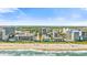 Expansive aerial view of the coastline, showing multiple high-rise buildings and a wide beach at 210 75Th Ave. N # 4045, Myrtle Beach, SC 29572