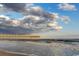 Wooden pier extending into the ocean under a cloudy sky at 210 75Th Ave. N # 4045, Myrtle Beach, SC 29572