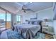 King-size bed, ocean view, ceiling fan in bedroom at 9650 Shore Dr. # 902, Myrtle Beach, SC 29572