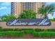 Maisons-sur-Mer building signage with landscaping at 9650 Shore Dr. # 902, Myrtle Beach, SC 29572