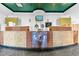Modern resort front desk with wood and stone finishes at 2500 N Ocean Blvd. # 605, Myrtle Beach, SC 29577