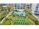 Relaxing pool area with lounge chairs, landscaping, and building view at 2500 N Ocean Blvd. # 605, Myrtle Beach, SC 29577