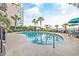 Inviting outdoor pool with surrounding lounge chairs and palm trees at 2500 N Ocean Blvd. # 605, Myrtle Beach, SC 29577