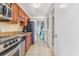 Kitchen with stainless steel appliances and view to bedroom at 2500 N Ocean Blvd. # 605, Myrtle Beach, SC 29577