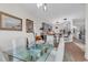 Open dining area with glass table and kitchen view at 249 Venice Way # 3-201, Myrtle Beach, SC 29577