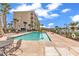 Inviting community pool with lounge chairs and patio tables at 249 Venice Way # 3-201, Myrtle Beach, SC 29577