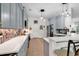 Stylish kitchen with gray cabinets, quartz countertops, and tile backsplash at 249 Venice Way # 3-201, Myrtle Beach, SC 29577