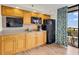Compact kitchen with microwave, refrigerator, and ocean view at 4800 S Ocean Blvd. # 319, North Myrtle Beach, SC 29582