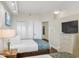 Two twin beds and a dresser in a condo bedroom at 4800 S Ocean Blvd. # 319, North Myrtle Beach, SC 29582