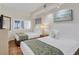 Two twin beds, ocean view, and wood floors in a condo bedroom at 4800 S Ocean Blvd. # 319, North Myrtle Beach, SC 29582