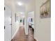 Bright hallway with wood floors, leading to bedrooms and other rooms at 4800 S Ocean Blvd. # 319, North Myrtle Beach, SC 29582