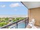 Relaxing balcony with ocean and pool views from chairs at 4800 S Ocean Blvd. # 319, North Myrtle Beach, SC 29582