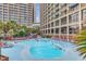 Resort-style pool with plenty of lounge chairs for relaxing in the sun at 4800 S Ocean Blvd. # 319, North Myrtle Beach, SC 29582