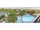 Aerial view of resort pool with palm trees and beach access at 4800 S Ocean Blvd. # 319, North Myrtle Beach, SC 29582
