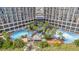 Aerial view showing resort complex with expansive pool area and lush landscaping at 4800 S Ocean Blvd. # 319, North Myrtle Beach, SC 29582