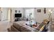 Spacious living room with comfortable seating and large windows at 805 Woodland Farms Circle, Aynor, SC 29511