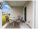 Relaxing patio with table and chairs, perfect for outdoor dining at 805 Woodland Farms Circle, Aynor, SC 29511