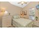 Bright guest bedroom featuring a queen-size bed and coastal-themed bedding at 6001 - 7026 S Kings Hwy., Myrtle Beach, SC 29575