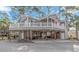 Two-story home with a large deck and covered parking at 6001 - 7026 S Kings Hwy., Myrtle Beach, SC 29575