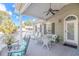Spacious deck with white wicker furniture and ceiling fan at 6001 - 7026 S Kings Hwy., Myrtle Beach, SC 29575