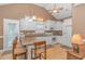 Bright kitchen with white cabinets, breakfast bar, and stainless steel appliances at 6001 - 7026 S Kings Hwy., Myrtle Beach, SC 29575
