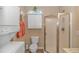 Clean bathroom with shower, toilet, and stackable washer/dryer at 6001 - 7026 S Kings Hwy., Myrtle Beach, SC 29575