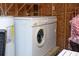 Stacked washer and dryer in a shared space at 1517 Schooner Ct., Garden City Beach, SC 29576