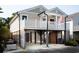 Two story home with a front deck and detached garage at 1517 Schooner Ct., Garden City Beach, SC 29576