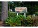 Photo of the community entrance sign for Woodland Villas at 1517 Schooner Ct., Garden City Beach, SC 29576