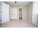 Bright bedroom with neutral walls, carpet flooring, and a double-door closet at 1517 Schooner Ct., Garden City Beach, SC 29576