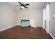 Simple bedroom with dark hardwood floors and ceiling fan at 1517 Schooner Ct., Garden City Beach, SC 29576