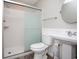 Clean bathroom with a walk-in shower, toilet, and pedestal sink at 1517 Schooner Ct., Garden City Beach, SC 29576