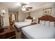 Bedroom with two double beds, ceiling fan, and en-suite bathroom at 1321 S Ocean Blvd. # 905, North Myrtle Beach, SC 29582