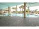 Resort-style pool with surrounding lounge chairs and palm trees at 1321 S Ocean Blvd. # 905, North Myrtle Beach, SC 29582