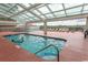 Indoor pool with retractable roof and plenty of lounge chairs at 1321 S Ocean Blvd. # 905, North Myrtle Beach, SC 29582