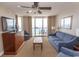 Ocean view living room with comfy seating and balcony access at 1321 S Ocean Blvd. # 905, North Myrtle Beach, SC 29582