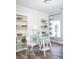 Bright and airy craft room featuring built-in shelving and a glass-top desk at 728 Isle Verde Dr, Myrtle Beach, SC 29579