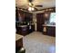 Cozy kitchen featuring dark wood cabinets and granite countertops at 710 Lakeside Dr., Surfside Beach, SC 29575