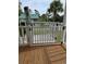 Elevated deck with railing and gate, offering views of the surroundings at 710 Lakeside Dr., Surfside Beach, SC 29575