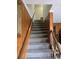 Indoor stairway with wood railings and carpeted steps at 710 Lakeside Dr., Surfside Beach, SC 29575