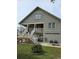 Two-story house showcasing a side view with patio and landscaping at 710 Lakeside Dr., Surfside Beach, SC 29575