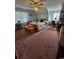 Large bedroom with ceiling fan and carpet flooring at 710 Lakeside Dr., Surfside Beach, SC 29575